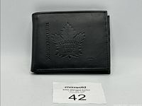 Front view of the black leather Toronto Maple Leafs wallet showing embossed logo and text