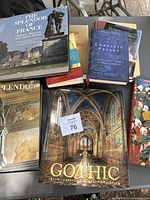 Photo showing seven hardcover books stacked and spread, featuring titles on European art, architecture, and religious themes.