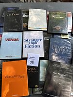 Photo showing multiple DVD movie screeners including The Village, The Departed, Sounder, The Fountain, Venus, Stranger Than Fiction, The Good Shepherd, Half Nelson, Akelah and the Bee, and others.