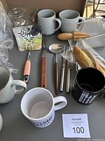 Lot of vintage kitchen items including mugs, utensils, glass teapot without lid