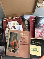 Overview of 8 books in a box including art, literary, and nature themes