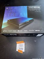 Photo of the TiVo Edge box showing the product image and supported streaming services.