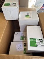 Boxed D'eco unbreakable champagne glasses packed inside a larger shipping box