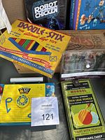 Vintage toys and drawing supplies boxed close-up view