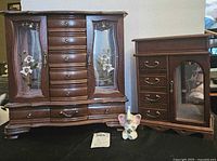Photo showing two wooden jewelry boxes side by side with the ceramic elephant ring holder in front.
