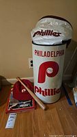 Metal and vinyl Philadelphia Phillies themed trashcan along with cooler bag top showing Phillies logo