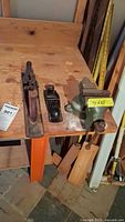 Photo of bench vise and two woodworking planes, showing rust and general condition.