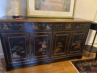 Full front view of credenza showing four drawers above two double-door cabinets with painted panels