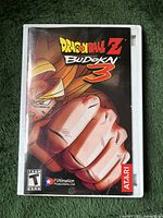 Front cover of the Dragonball Z Budokai 3 PlayStation 2 game case showing artwork of character Goku and game title.