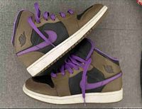 Side profile of both sneakers showing brown, black and purple panels with white midsoles and purple laces.
