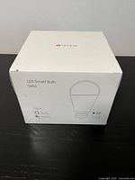 Front view of sealed TECKIN LED Smart Bulb SB50 box showing product branding and bulb outline.