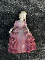 Front view of Royal Doulton Rose figurine showing the figure of a woman in a detailed pink gown.