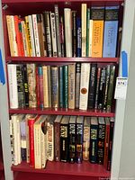 Three shelves of assorted books including literature, science fiction, fantasy