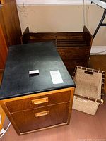 All items grouped: file cabinet at left, magazine rack behind, wicker basket at right