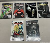 Six Batman comic books displayed in two rows on a flat surface, showing covers of Endgame series and other Batman issues.