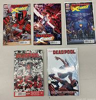 Top view showing five Deadpool and X-Force comics with colorful covers in excellent condition.