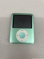 Front view of green Apple iPod Nano 3rd Generation showing screen and click wheel.