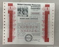 Front view of bearer share certificate showing details, photograph, text, signatures and official seal.