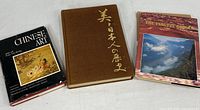 Three books displayed together: Chinese Art with dust jacket, Japan: A History in Art hardcover, and The Yangtze Gorges photography book