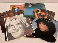 Stack of 12 vintage vinyl albums with visible covers including Marlena Shaw, Aretha Franklin, Minnie Riperton, Deniece Williams, and others.