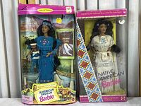 Photo of two boxed Mattel Native American Barbie dolls from Dolls of the World Collection and American Stories Series.
