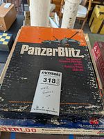 Photo showing PanzerBlitz game box with wear and tear.