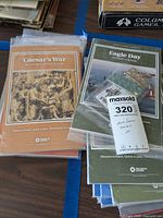 Photo showing covers of Caesar's War and Eagle Day editions in plastic packaging, indicating the mini game series from Decision Games.