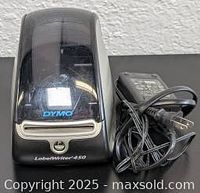 Front view of the Dymo LabelWriter 450 thermal label printer with closed clear cover and black body showing Dymo logo and LabelWriter 450 branding.