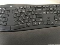 Close-up of middle section of keyboard showing keys around the center split and additional function keys above.