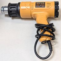 Front side view of SEEKONE heat gun showing nozzle, body, and coiled cord.