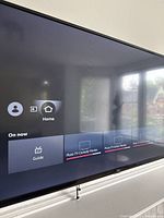 Close up of the Fire TV screen interface showing guide with Pluto TV channels, confirming Fire TV smart TV functionality.