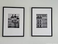 Two framed black and white photos showing Paris street scenes hung side by side on a wall