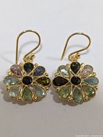 Top down view of the earrings showing the flower shape and colorful tourmaline stones