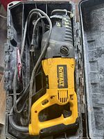 Top view of the DeWalt DW311 reciprocating saw showing overall tool with power cord in case.