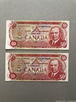 Front of both notes showing portrait and serial numbers