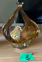 Front and side view of amber Murano glass centerpiece with shells inside (shells not included).