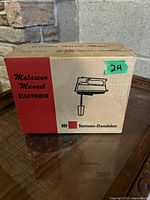 Original box front showing the brand Samson-Dominion, product name in French and English, and illustration of the hand mixer.