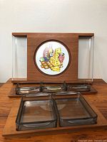 Full set of teak condiment tray with four small glass dishes in compartments and two larger plastic dishes in front