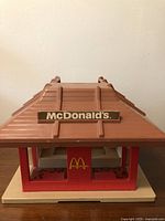 Front view of the Playskool McDonald's restaurant toy showing brown rooftop and gold McDonald's sign.