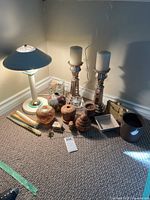Overall group view on carpet showing lamp, candlesticks, planters and assorted decor
