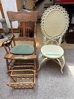 Wooden rocking chair with green cushion, painted white rattan chair, and wooden magazine rack shown together.