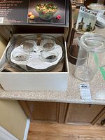 Punch set components in box showing cups and bowl.