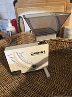 Front view of Cuisinart kitchen scale showing analog display and plastic weighing bowl