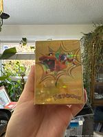 Front of the unopened sealed Pokemon foil card box with Charizard artwork.