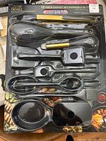 Photo shows complete set of kitchen utensils and tools in black and gold finish inside original retail packaging labeled Thyme & Table 12-piece gadget set.