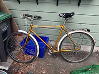 Side view of the vintage Mercury bicycle showing the overall frame, tires, seat, and handlebar.