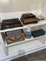 Shelf view showing six storage containers