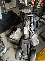 Golf push cart with bag and crate of balls