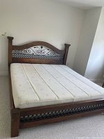 Full view of assembled king bed frame with mattress
