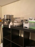 Overall view of all kitchenware items on shelving unit